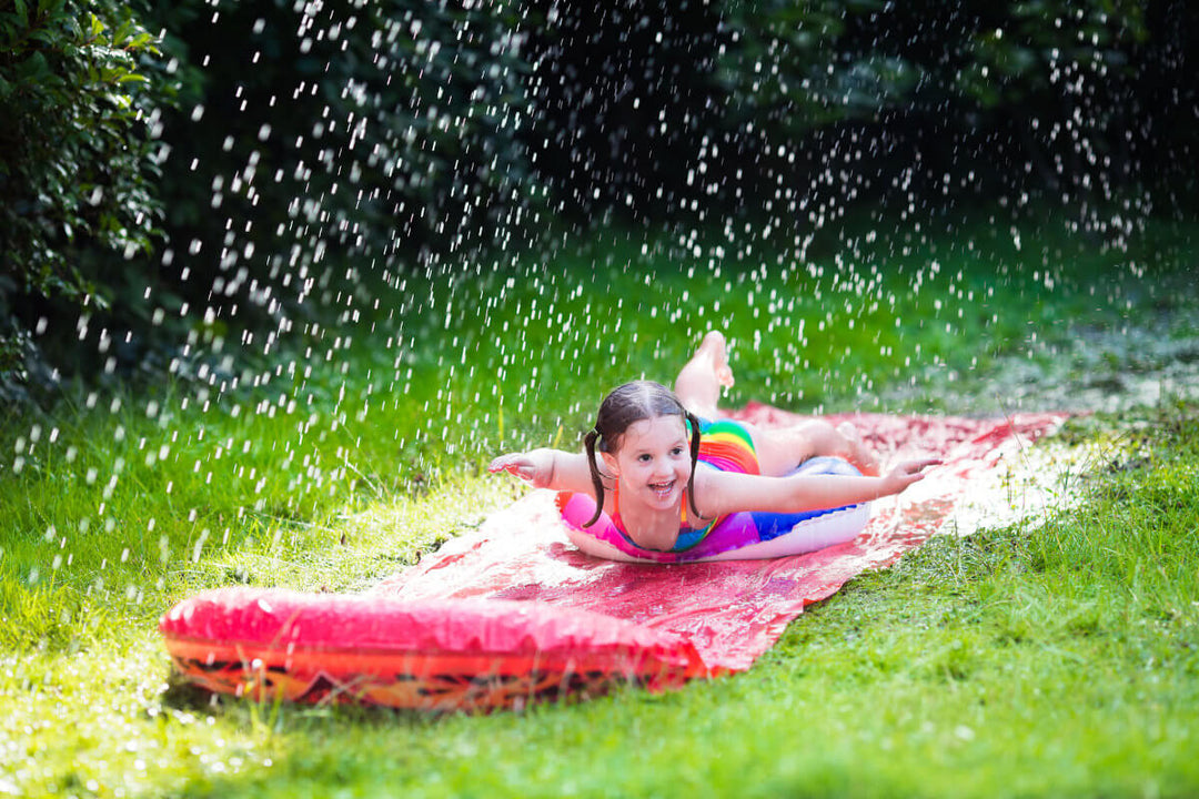 girl sliding down waterslide